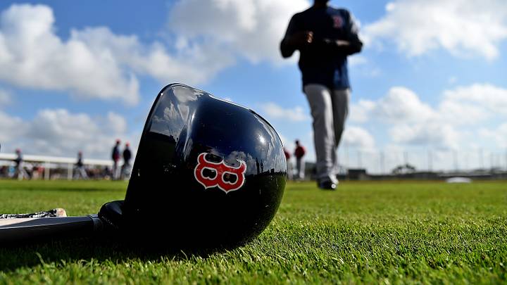 Feb 18, 2019; Lee County, FL, USA; A general view of a Boston Red Sox helmet as Boston Red Sox center fielder Jackie Bradley Jr. (19) walks on the field during a spring training workout at Jet Blue Park at Fenway South. Mandatory Credit: Jasen Vinlove-USA TODAY Sports