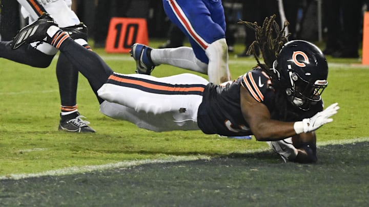 Aug 17, 2025; Chicago, Illinois, USA;  Chicago Bears running back Ian Wheeler (33) leaps into the end zone for a touchdown during the second half against the Buffalo Bills at Soldier Field. Mandatory Credit: Matt Marton-Imagn Images