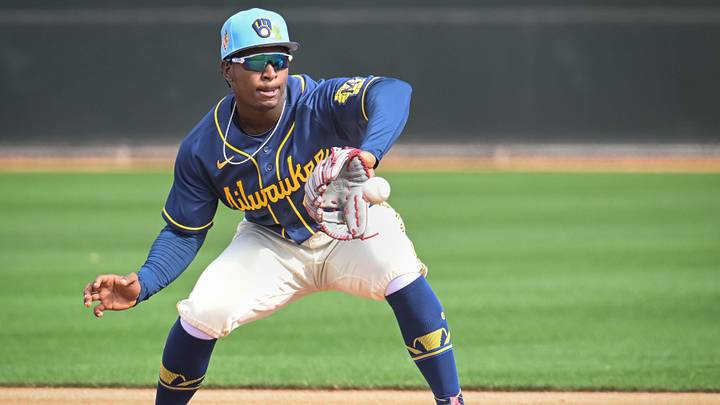 Milwaukee Brewers infield prospect Luis Pena takes a throw in a double-play drill during spring training workouts Sunday, February 15, 2026, at American Family Fields of Phoenix in Phoenix, Arizona.