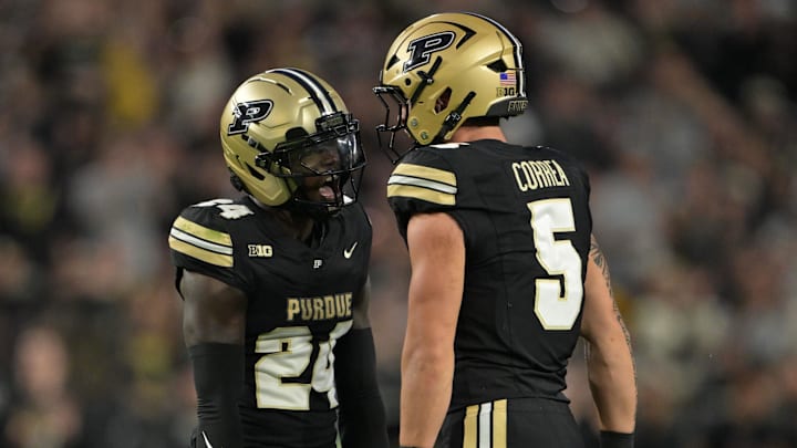 Purdue Boilermakers running back Malachi Thomas (24) celebrates a sack with linebacker Charles Correa (5) Purdue Boilermakers running back Malachi Thomas (24) celebrates a sack with linebacker Charles Correa (5)