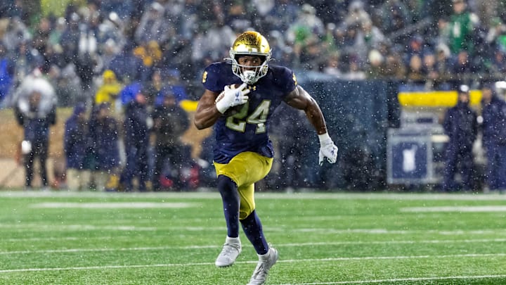 Nov 8, 2025; South Bend, Indiana, USA; Notre Dame Fighting Irish running back Jadarian Price (24) runs the ball against the Navy Midshipmen during the second half at Notre Dame Stadium. Mandatory Credit: Michael Caterina-Imagn Images