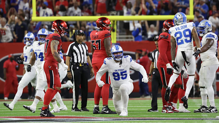 Nov 10, 2024; Houston, Texas, USA;Detroit Lions defensive end Pat O'Connor (95) and teammates celebrate after Houston Texans place kicker Ka'imi Fairbairn (15) (not pictured) missed the game winning field goal in the fourth quarter at NRG Stadium. Mandatory Credit: Thomas B. Shea-Imagn Images