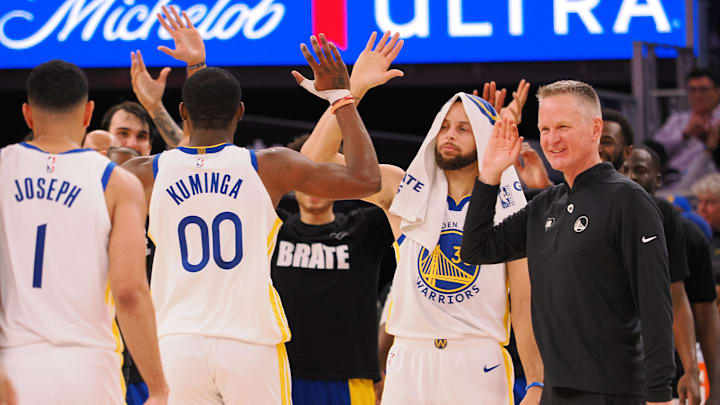 Jan 24, 2024; San Francisco, California, USA; Golden State Warriors forward Jonathan Kuminga (00) high fives guard Stephen Curry (30) and head coach Steve Kerr as a time out is called against the Atlanta Hawks during the fourth quarter at Chase Center. Mandatory Credit: Kelley L Cox-Imagn Images Jan 24, 2024; San Francisco, California, USA; Golden State Warriors forward Jonathan Kuminga (00) high fives guard Stephen Curry (30) and head coach Steve Kerr as a time out is called against the Atlanta Hawks during the fourth quarter at Chase Center. Mandatory Credit: Kelley L Cox-Imagn Images