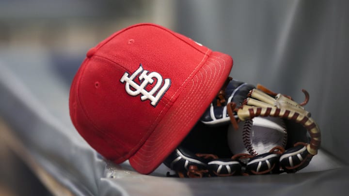 Sep 17, 2018; Atlanta, GA, USA; Detailed view of a St. Louis Cardinals hat and glove in the dugout against the Atlanta Braves in the first inning at SunTrust Park. Mandatory Credit: Brett Davis-Imagn Images
Sep 17, 2018; Atlanta, GA, USA; Detailed view of a St. Louis Cardinals hat and glove in the dugout against the Atlanta Braves in the first inning at SunTrust Park. Mandatory Credit: Brett Davis-Imagn Images