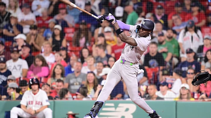 Jul 28, 2024; Boston, Massachusetts, USA; New York Yankees center fielder Jazz Chisholm Jr (13) hits a single against the Boston Red Sox during the ninth inning at Fenway Park. Mandatory Credit: Eric Canha-Imagn Images