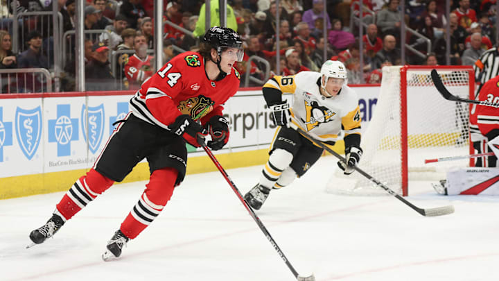 Apr 6, 2025; Chicago, Illinois, USA; Chicago Blackhawks defenseman Kevin Korchinski (14) skates with the puck against the Pittsburgh Penguins during the second period at United Center. Mandatory Credit: Talia Sprague-Imagn Images Apr 6, 2025; Chicago, Illinois, USA; Chicago Blackhawks defenseman Kevin Korchinski (14) skates with the puck against the Pittsburgh Penguins during the second period at United Center. Mandatory Credit: Talia Sprague-Imagn Images
