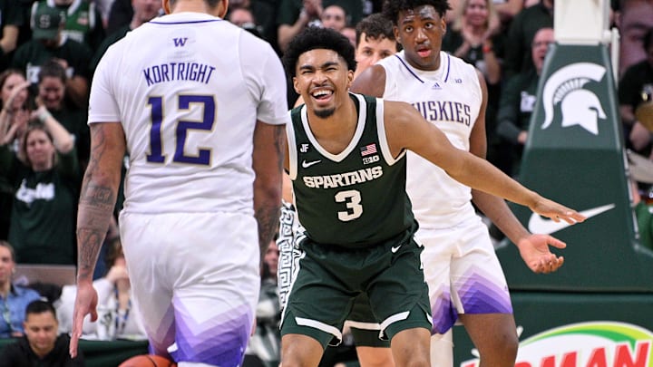 Jan 9, 2025; East Lansing, Michigan, USA;  Michigan State Spartans guard Jaden Akins (3) reacts after scoring against the Washington Huskies at Jack Breslin Student Events Center. Mandatory Credit: Dale Young-Imagn Images