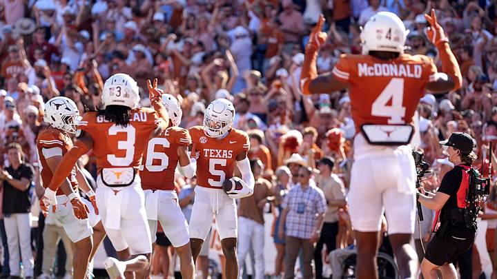 Texas Longhorns defensive back Malik Muhammad celebrates an interception in the first half of the Red River Rivalry college football game between the University of Oklahoma Sooners and the Longhorns at the Cotton Bowl Stadium in Dallas, Texas, Saturday, Oct. 11, 2025.