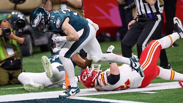 Feb 9, 2025; New Orleans, LA, USA; Philadelphia Eagles cornerback Cooper DeJean (33) scores a touchdown after making an interception against the Kansas City Chiefs during the first half of Super Bowl LIX at Caesars Superdome. 