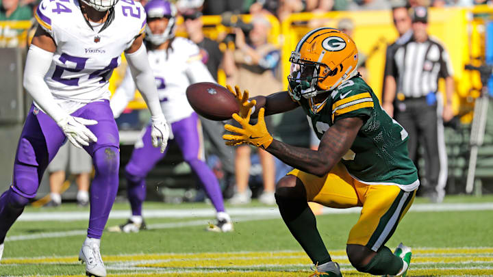 Green Bay Packers wide receiver Dontayvion Wicks (13) scores a touchdown in the fourth quarter against the Minnesota Vikings.