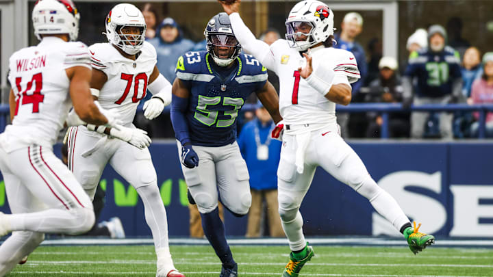 Nov 24, 2024; Seattle, Washington, USA; Arizona Cardinals quarterback Kyler Murray (1) passes away from Seattle Seahawks linebacker Boye Mafe (53) during the first quarter at Lumen Field. Arizona Cardinals offensive tackle Paris Johnson Jr. (70) follows the play at left. Mandatory Credit: Joe Nicholson-Imagn Images Nov 24, 2024; Seattle, Washington, USA; Arizona Cardinals quarterback Kyler Murray (1) passes away from Seattle Seahawks linebacker Boye Mafe (53) during the first quarter at Lumen Field. Arizona Cardinals offensive tackle Paris Johnson Jr. (70) follows the play at left. Mandatory Credit: Joe Nicholson-Imagn Images