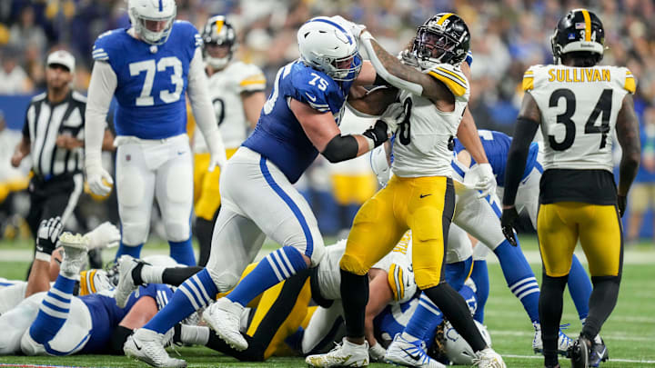 Indianapolis Colts guard Will Fries (75) and Pittsburgh Steelers linebacker Mykal Walker (38) tangle after a play Saturday, Dec. 16, 2023, during a game against the Pittsburgh Steelers at Lucas Oil Stadium in Indianapolis. Indianapolis Colts guard Will Fries (75) and Pittsburgh Steelers linebacker Mykal Walker (38) tangle after a play Saturday, Dec. 16, 2023, during a game against the Pittsburgh Steelers at Lucas Oil Stadium in Indianapolis.