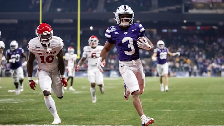 Dec 26, 2024; Phoenix, AZ, USA; Kansas State Wildcats running back Dylan Edwards (3) runs for a touchdown against the Rutgers Scarlet Knights during the second half of the Rate Bowl at Chase Field. Mandatory Credit: Mark J. Rebilas-Imagn Images