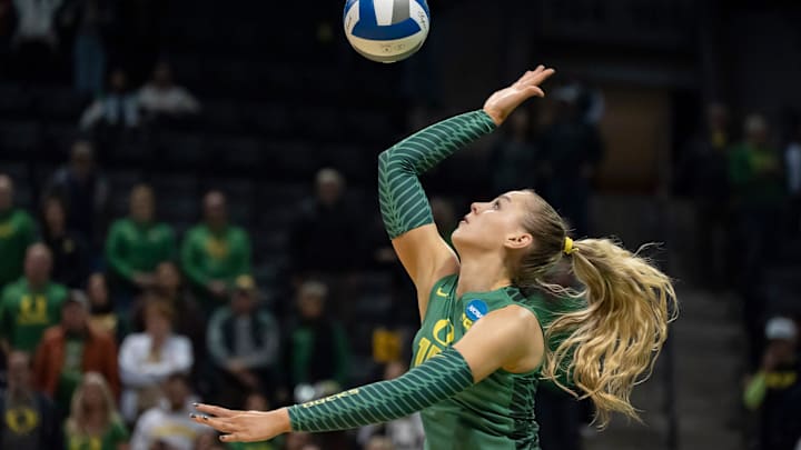 Oregon outside hitter Mimi Colyer serves as the Oregon Ducks host High Point in the first round of the NCAA volleyball tournament on Thursday, Dec. 5, 2024, at Matthew Knight Arena in Eugene, Ore.