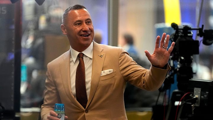 July 15, 2025; Atlanta, GA, USA; Texas head coach Steve Sarkisian waves to fans during SEC Media Days at the College Football Hall of Fame in Atlanta.