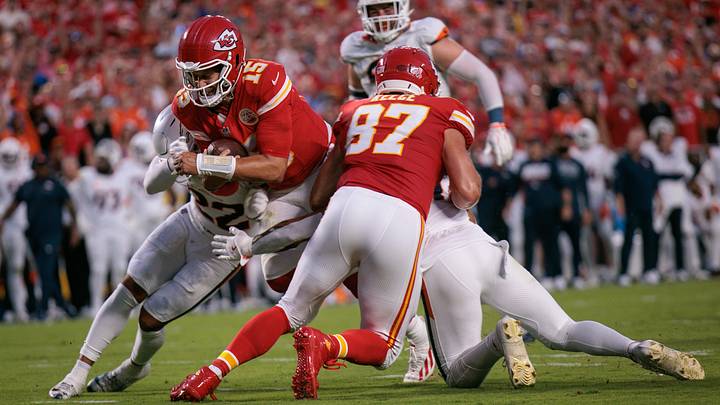KANSAS CITY, MO - SEPTEMBER 14: Kansas City Chiefs quarterback Patrick Mahomes dives for the end zone while Travis Kelce holds Denver Broncos safety Talanoa Hufanga. KANSAS CITY, MO - SEPTEMBER 14: Kansas City Chiefs quarterback Patrick Mahomes dives for the end zone while Travis Kelce holds Denver Broncos safety Talanoa Hufanga.