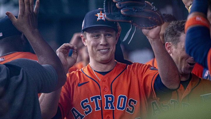 Jun 15, 2022; Arlington, Texas, USA; Houston Astros relief pitcher Phil Maton (88) is congratulated by his teammates after the seventh inning against the Texas Rangers at Globe Life Field. Mandatory Credit: Jerome Miron-Imagn Images