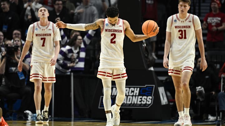 Mar 19, 2026; Portland, OR, USA; Wisconsin Badgers guard Andrew Rohde (7), guard Nick Boyd (2), and forward Nolan Winter (31) react during the second half of a first round game of the men's 2026 NCAA Tournament against the High Point Panthers at Moda Center. Mandatory Credit: Troy Wayrynen-Imagn Images