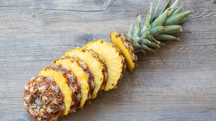 Vibrant, green leaves are a key indicator of a ripe pineapple.
