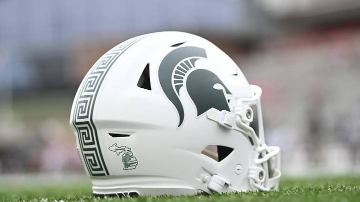 Sep 7, 2024; College Park, Maryland, USA; A detailed view of Michigan State Spartans helmet on the field before the game against the Maryland Terrapins at SECU Stadium.