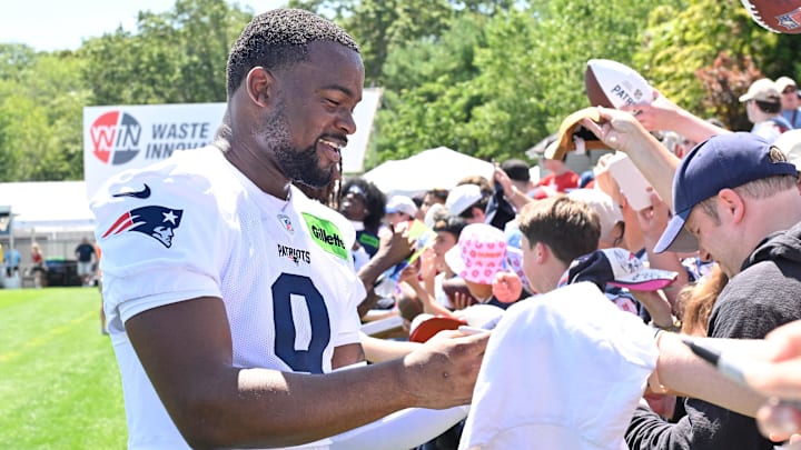 Jul 23, 2025; Foxborough, MA, USA; New England Patriots wide receiver Kayshon Boutte (9) signs an autograph for a fan after practice during day one of training camp at Gillette Stadium. Mandatory Credit: Eric Canha-Imagn Images