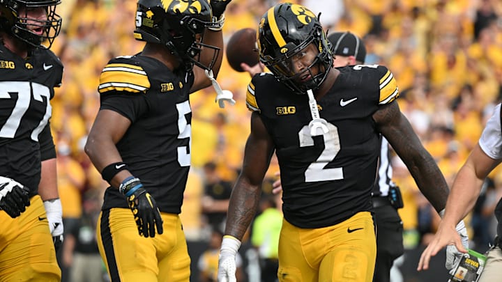 Sep 14, 2024; Iowa City, Iowa, USA; Iowa Hawkeyes running back Kaleb Johnson (2) reacts with wide receiver Jacob Gill (5) after running for a 4 yard touchdown against the Troy Trojans during the second quarter at Kinnick Stadium. Mandatory Credit: Jeffrey Becker-Imagn Images