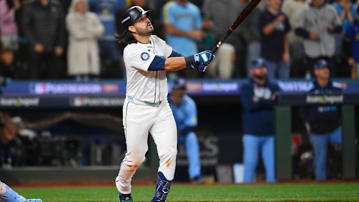 Oct 17, 2025; Seattle, Washington, USA; Seattle Mariners third baseman Eugenio Suarez (28) hits a grand slam against the Toronto Blue Jays during the eighth inning during game five of the ALCS round for the 2025 MLB playoffs at T-Mobile Park. Mandatory Credit: Steven Bisig-Imagn Images