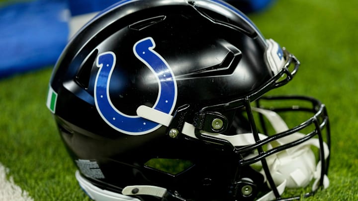 A black Indianapolis Colts helmet sits on the turf Sunday, Nov. 24, 2024, during a game against the Detroit Lions at Lucas Oil Stadium in Indianapolis.