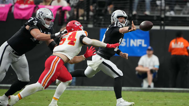Oct 27, 2024; Paradise, Nevada, USA; Las Vegas Raiders quarterback Gardner Minshew (15) throws the ball against Kansas City Chiefs linebacker Leo Chenal (54) in the first half at Allegiant Stadium. Mandatory Credit: Kirby Lee-Imagn Images