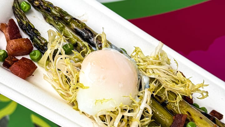 Grilled asparagus with poached egg and spring peas
