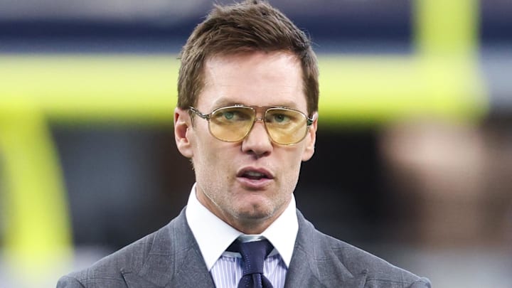 Former NFL quarterback Tom Brady looks on from the sideline before the game between the Philadelphia Eagles and Dallas Cowboys at AT&T Stadium Former NFL quarterback Tom Brady looks on from the sideline before the game between the Philadelphia Eagles and Dallas Cowboys at AT&T Stadium