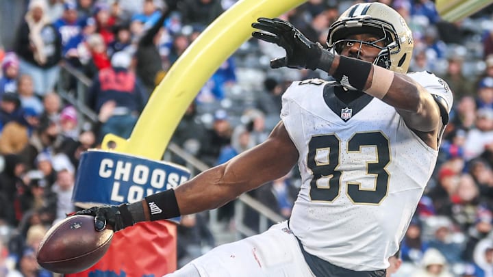 Dec 8, 2024; East Rutherford, New Jersey, USA; New Orleans Saints tight end Juwan Johnson (83) celebrates after a touchdown reception during the second half against the New York Giants at MetLife Stadium. Mandatory Credit: Vincent Carchietta-Imagn Images
