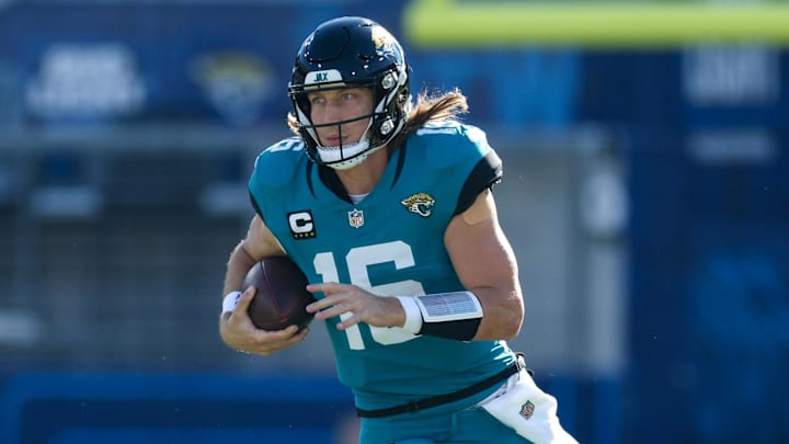 Dec 1, 2024; Jacksonville, Florida, USA; Jacksonville Jaguars quarterback Trevor Lawrence (16) runs with the ball against the Houston Texans in the second quarter at EverBank Stadium. Mandatory Credit: Nathan Ray Seebeck-Imagn Images