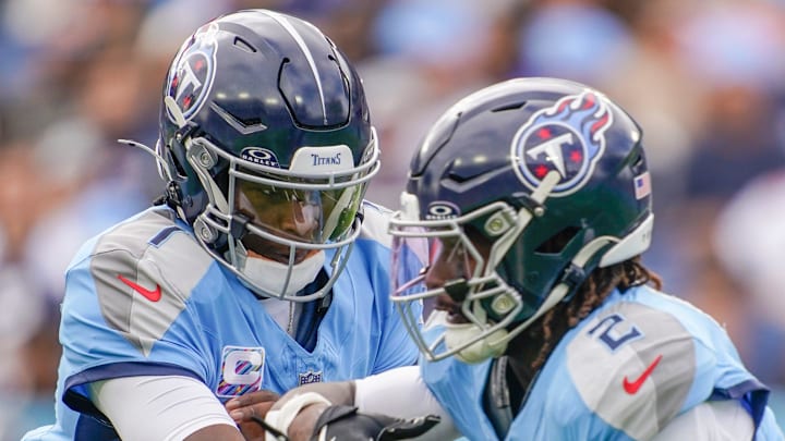 Tennessee Titans quarterback Cam Ward (1) hands off to running back Tyjae Spears (2) during the first quarter against the New England Patriots at Nissan Stadium in Nashville, Tenn., Sunday, Oct. 19, 2025. Tennessee Titans quarterback Cam Ward (1) hands off to running back Tyjae Spears (2) during the first quarter against the New England Patriots at Nissan Stadium in Nashville, Tenn., Sunday, Oct. 19, 2025.