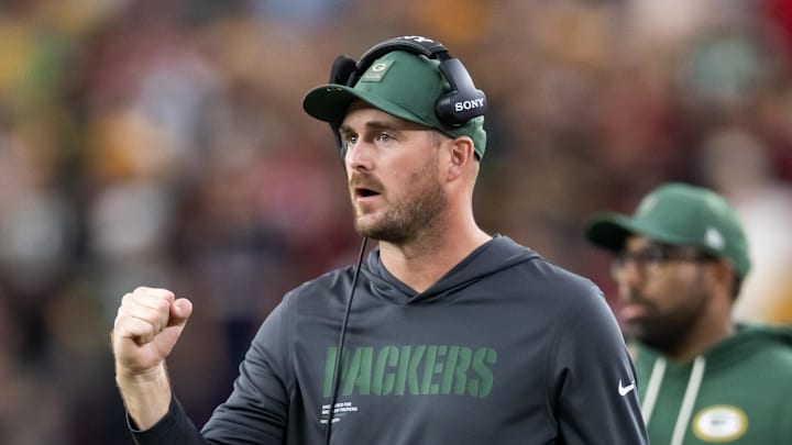 Oct 19, 2025; Glendale, Arizona, USA; Green Bay Packers quarterbacks coach Sean Mannion against the Arizona Cardinals at State Farm Stadium. Mandatory Credit: Mark J. Rebilas-Imagn Images