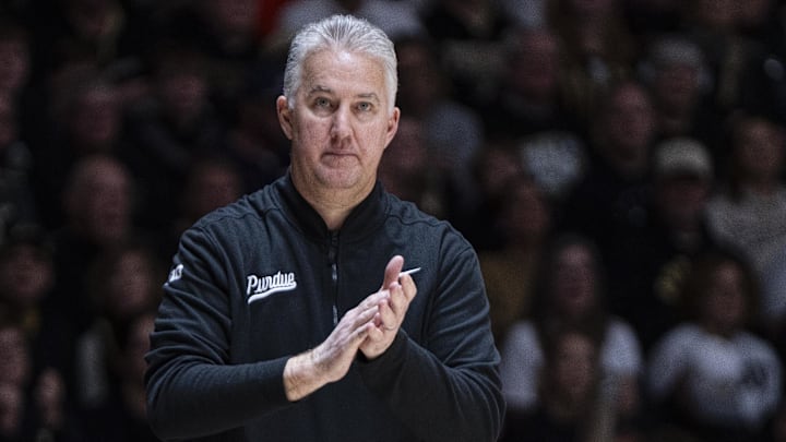 Purdue Boilermakers head coach Matt Painter claps after a foul is called.