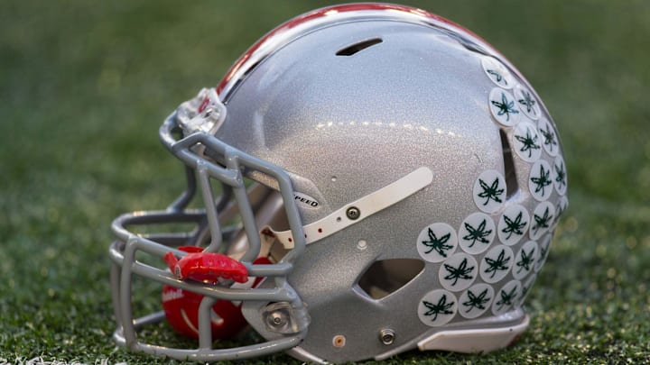 Nov 17, 2012; Madison, WI, USA; A Ohio State Buckeyes helmet sits on the sidelines during the game against the Wisconsin Badgers at Camp Randall Stadium. Ohio State defeated Wisconsin 21-14 in overtime. Mandatory Credit: Jeff Hanisch-Imagn Images Nov 17, 2012; Madison, WI, USA; A Ohio State Buckeyes helmet sits on the sidelines during the game against the Wisconsin Badgers at Camp Randall Stadium. Ohio State defeated Wisconsin 21-14 in overtime. Mandatory Credit: Jeff Hanisch-Imagn Images