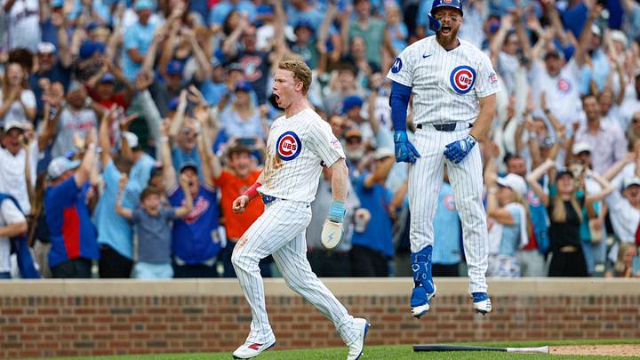 Aug 6, 2026; Chicago, Illinois, USA; Chicago Cubs designated hitter Pete Crow-Armstrong (4) celebrates with first baseman Michael Busch (29) after scoring a game winning run against the Toronto Blue Jays during the 11th inning at Wrigley Field. Mandatory Credit: Kamil Krzaczynski-Imagn Images