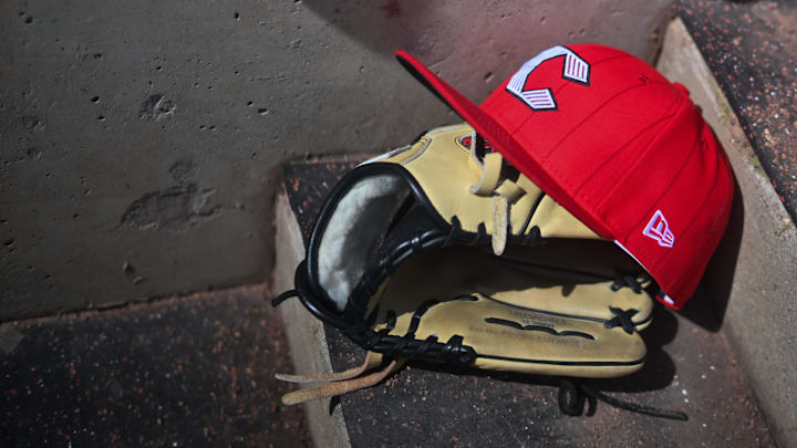 Apr 11, 2026; Cincinnati, Ohio, USA;  A view of an official Cincinnati Reds hat on the dugout steps during the game against the Los Angeles Angels at Great American Ball Park. Mandatory Credit: Aaron Doster-Imagn Images
