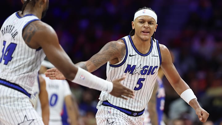 Oct 27, 2025; Philadelphia, Pennsylvania, USA; Orlando Magic forward Paolo Banchero (5) reacts with center Wendell Carter Jr. (34) after a score against the Philadelphia 76ers during the fourth quarter at Xfinity Mobile Arena. Mandatory Credit: Bill Streicher-Imagn Images