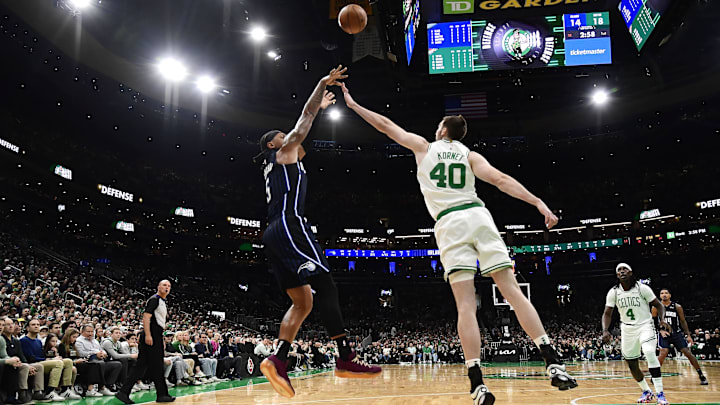 Orlando Magic forward Paolo Banchero (5) shoots the ball over Boston Celtics center Luke Kornet (40) during the first half at TD Garden.