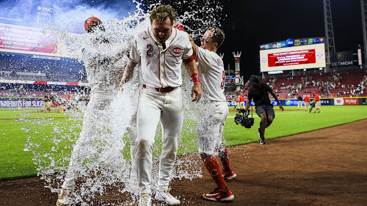 Jun 24, 2025; Cincinnati, Ohio, USA; Cincinnati Reds pinch hitter Gavin Lux (2) is dunked by water after hitting a walk-off single in the eleventh inning against the New York Yankees at Great American Ball Park. Mandatory Credit: Katie Stratman-Imagn Images