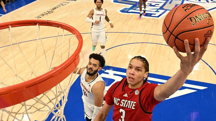 Mar 12, 2026; Charlotte, NC, USA; NC State Wolfpack guard Matt Able (3) scores as Virginia Cavaliers forward Devin Tillis (11) defends in the first half at Spectrum Center. Mandatory Credit: Bob Donnan-Imagn Images Mar 12, 2026; Charlotte, NC, USA; NC State Wolfpack guard Matt Able (3) scores as Virginia Cavaliers forward Devin Tillis (11) defends in the first half at Spectrum Center. Mandatory Credit: Bob Donnan-Imagn Images