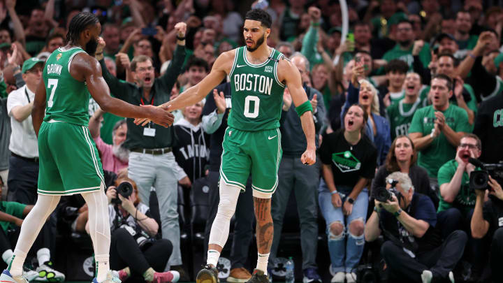 Jun 17, 2024; Boston, Massachusetts, USA; Boston Celtics forward Jayson Tatum (0) celebrates with guard Jaylen Brown (7) after a play against the Dallas Mavericks during the second quarter in game five of the 2024 NBA Finals at TD Garden. Mandatory Credit: Peter Casey-USA TODAY Sports