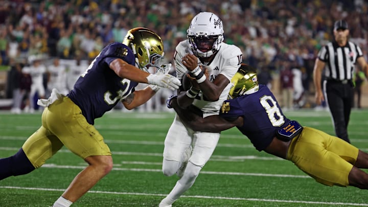 Sep 13, 2025; South Bend, Indiana, USA; Texas A&M Aggies quarterback Marcel Reed (10) runs the ball as Notre Dame Fighting Irish safety Adon Shuler (8) goes for a tackle during the second half at Notre Dame Stadium. Mandatory Credit: Trevor Ruszkowski-Imagn Images