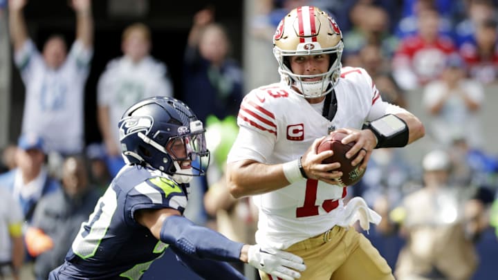 Sep 7, 2025; Seattle, Washington, USA; San Francisco 49ers quarterback Brock Purdy (13) runs the ball during the first half against the Seattle Seahawks at Lumen Field. Mandatory Credit: Joe Nicholson-Imagn Images