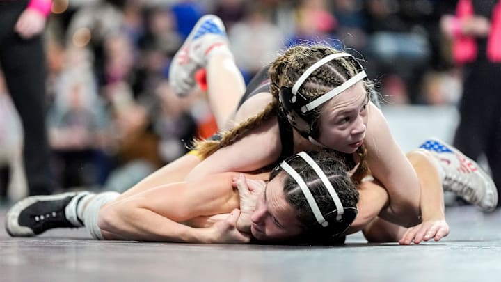Denver’s Abigail Peterson (top) wrestles West Marshall’s Kielly Kasal in a Class 1A 100-pound semifinal match Feb. 6, 2026 during the IGHSAU State Wrestling Championship at Xtream Arena in Coralville, Iowa. She is ranked No. 1 at 95-pounds in our latest girls' wrestling national rankings.