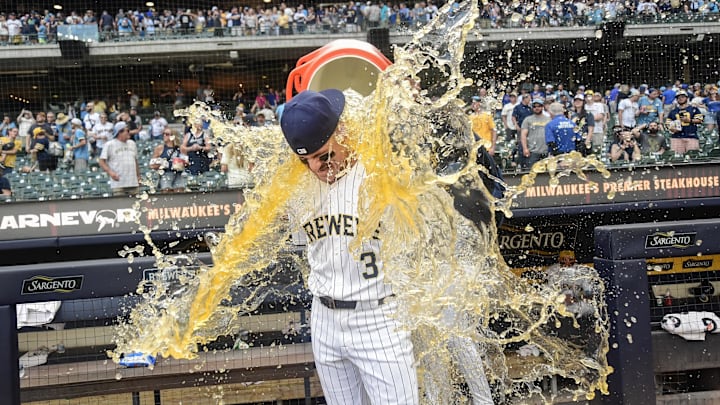 Jun 28, 2025; Milwaukee, Wisconsin, USA;  Milwaukee Brewers shortstop Joey Ortiz (3) gets the post game dunk after the Brewers defeated the Colorado Rockies at American Family Field. Mandatory Credit: Benny Sieu-Imagn Images