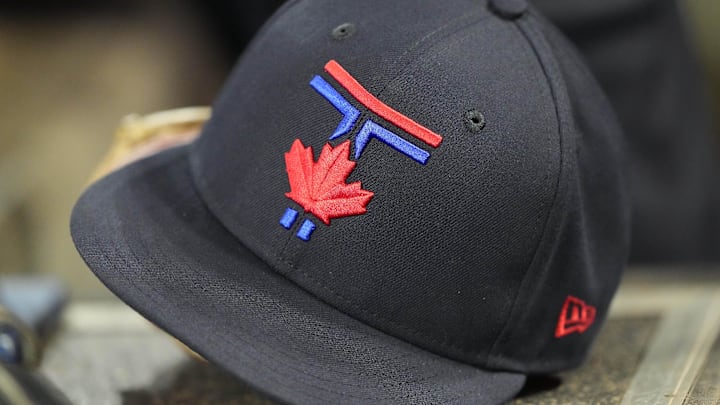 A Toronto Blue Jays ball cap sit in the dug out during the eighth inning against the San Francisco Giants at Rogers Centre.