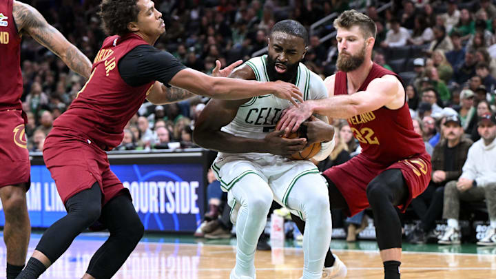 Oct 12, 2025; Boston, Massachusetts, USA; Cleveland Cavaliers forward/center Larry Nance Jr. (22) defends Boston Celtics guard/forward Jaylen Brown (7) during the first half at TD Garden. Mandatory Credit: Brian Fluharty-Imagn Images